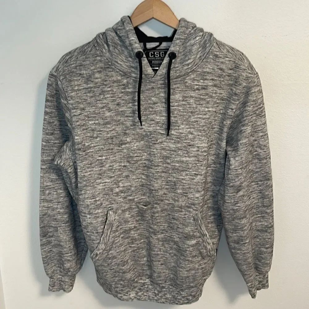 CSG Champs Sports Gear pullover hoodie.  Drawstring hood.  Size Men’s Medium.